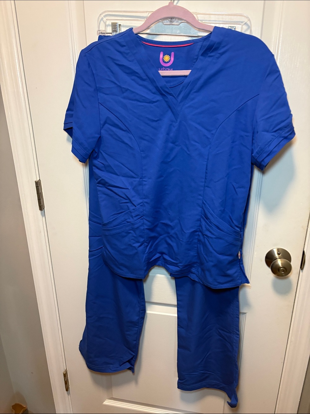 Urbane Blue Top with Pink Logo and Yellow Accent